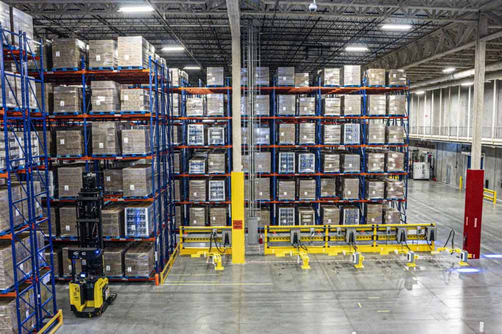 Image of inside the P&G warehouse, filled with boxes of product.