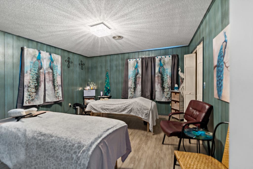 Another featured spa room, with multiple beds.